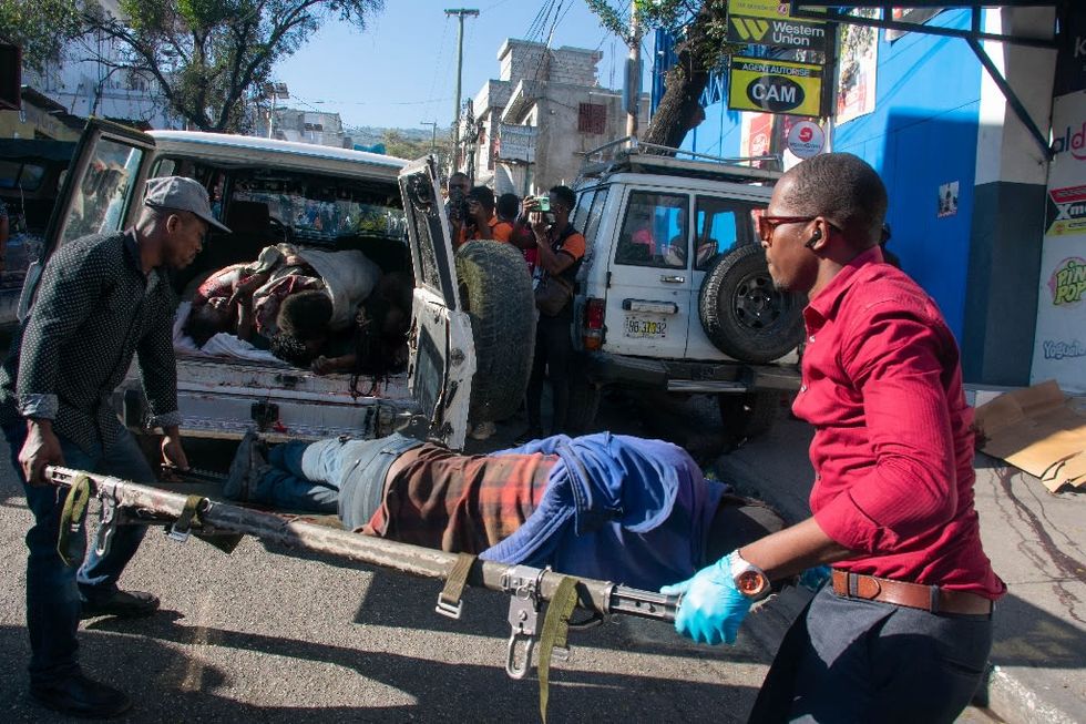 Bodies found in Haitian suburb as gang violence rages for third week