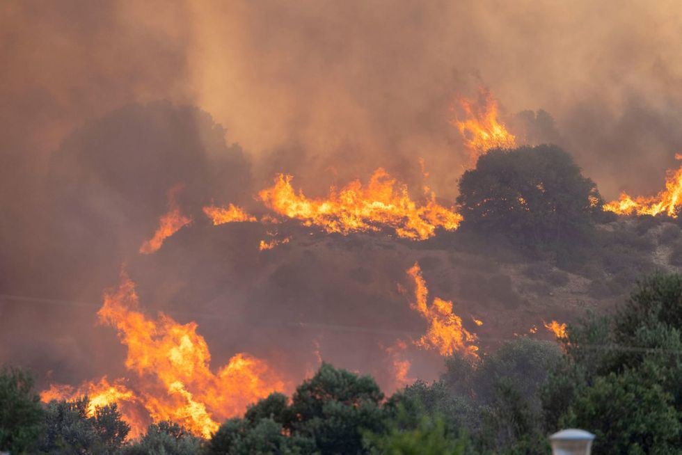 Authorities issue alert as early forest fires rage in Greece