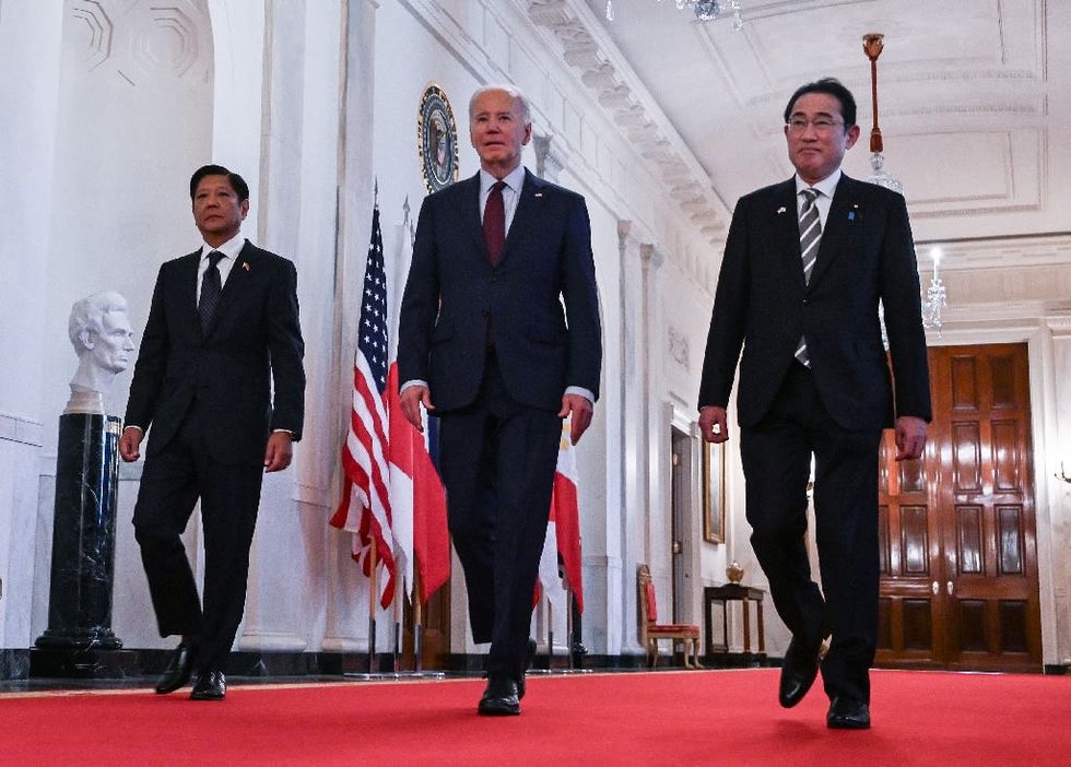 Biden vows 'ironclad' defense of Philippines, Japan