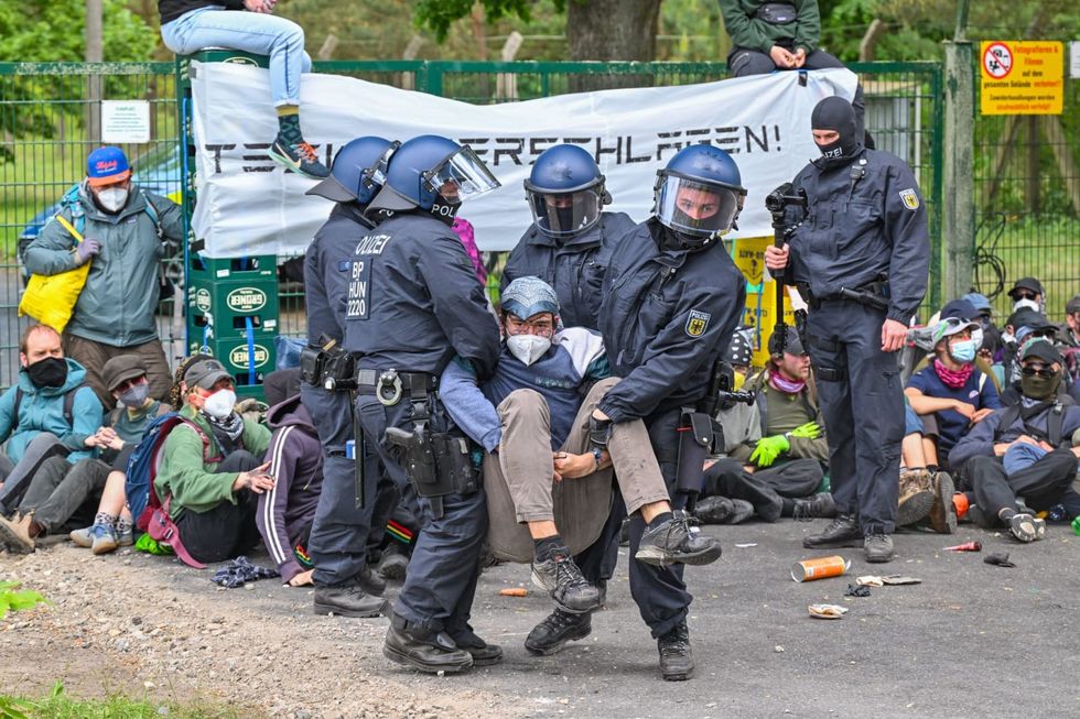 Protesters try to enter Tesla factory grounds outside Berlin