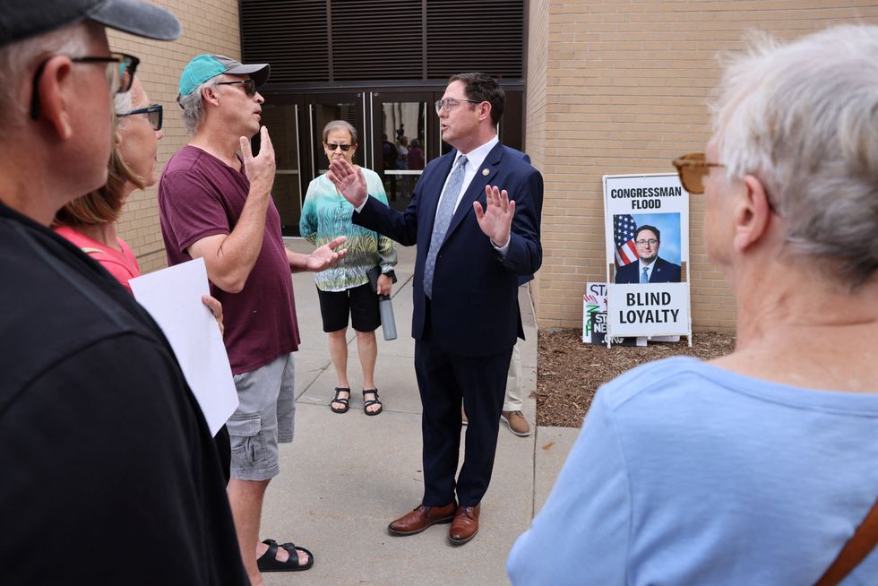 GOP lawmaker hammered with questions about Trump by angry town hall attendees