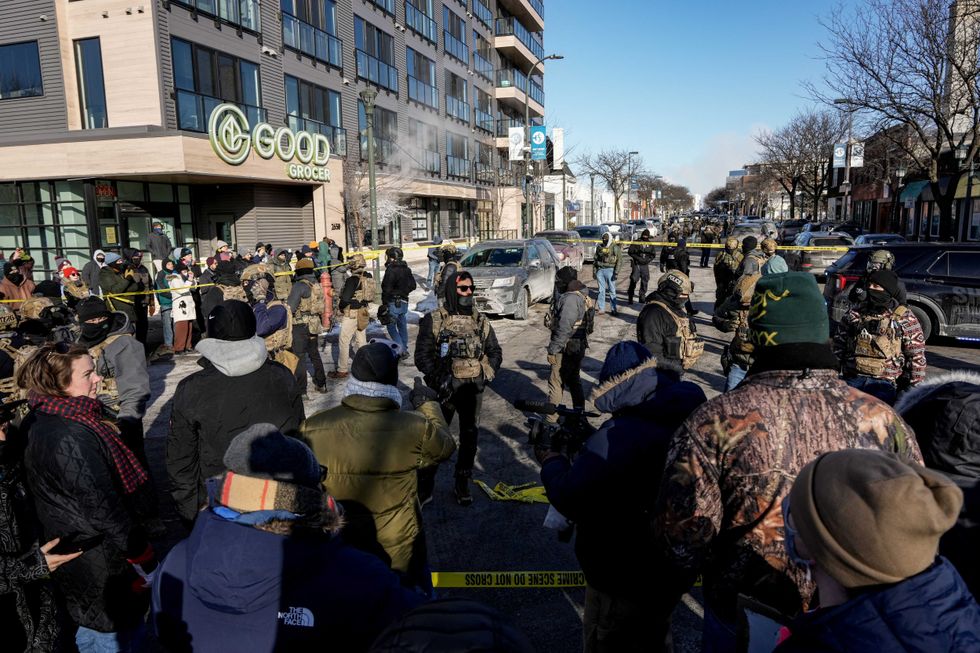 Video: Man shot and killed in Minneapolis as federal agents hold him down