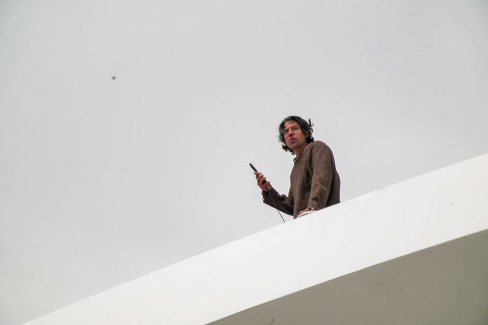 Activist scales DC bridge in protest of Trump’s ‘colossal failure’ Iran war