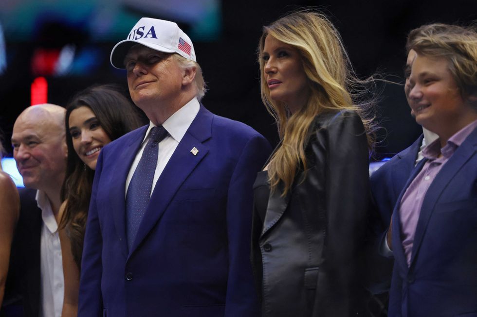 Trump caught smiling after UFC fighter drops shocking remark about Michelle Obama: report