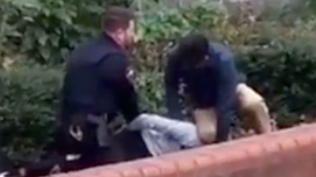'How does this occur?' Video shows principal kneeling on student's neck as officer handcuffs him