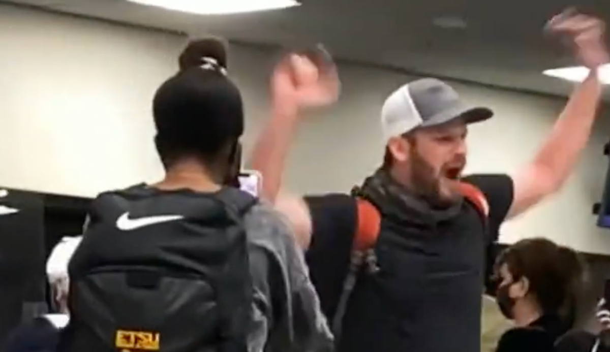 WATCH: COVID denier urges people in airport to 'rise up' against masks — and gets laughed at by bystanders