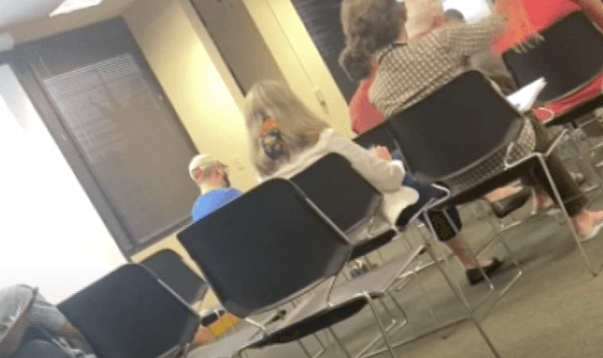 Man and woman caught flashing Nazi salutes at chaotic Ohio school board meeting