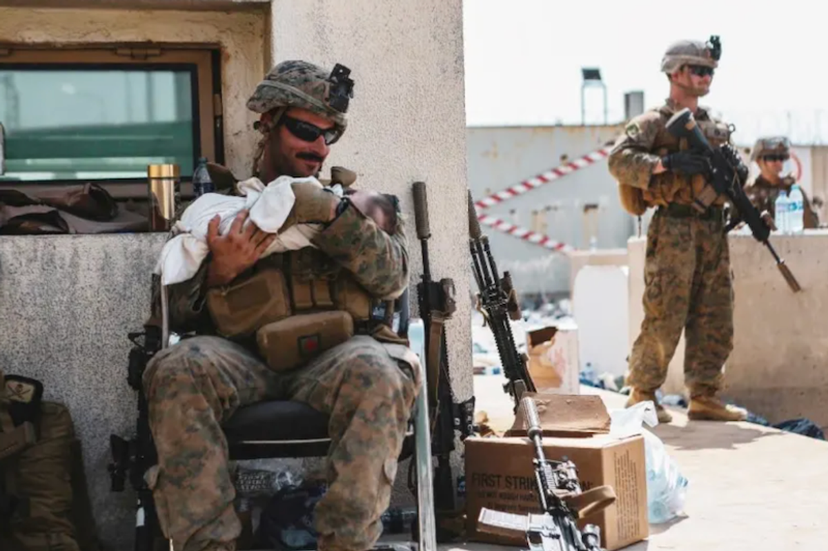 Viral footage of US Marine aiding baby captures Kabul chaos
