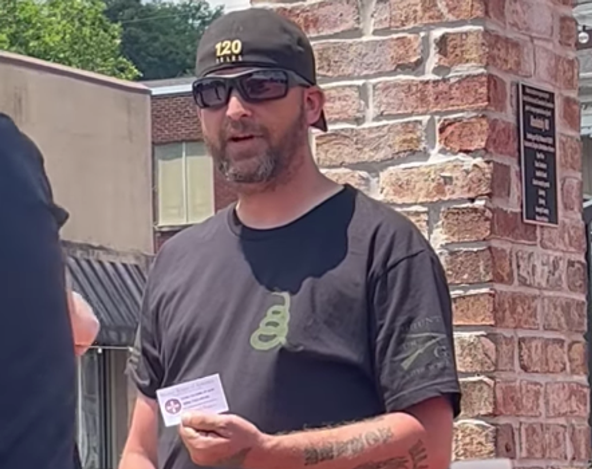 KKK members who pulled guns on LGBTQ protesters weren’t arrested because cops didn’t see them: police