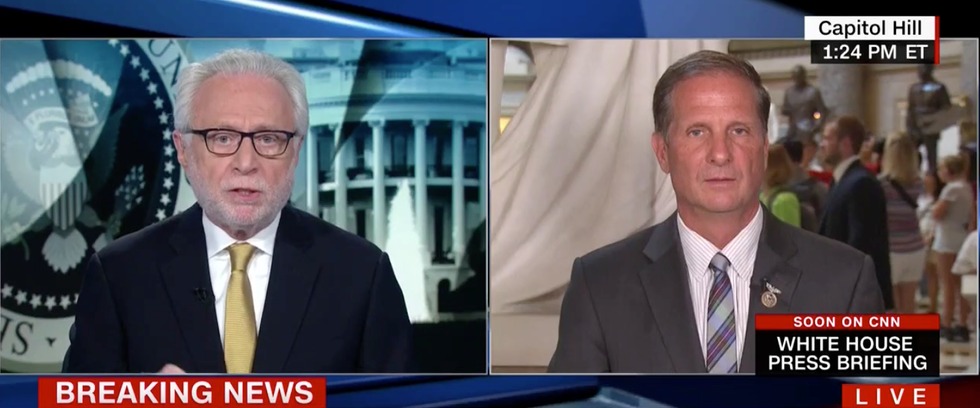 Watch CNN's Wolf Blitzer grill a House Intel Republican for backing Trump's latest weakening of NATO