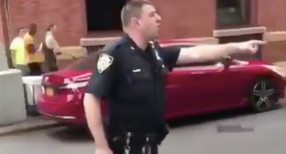 WATCH: NYPD cop whips out gun and screams 'go shoot heroin and die' outside addiction clinic