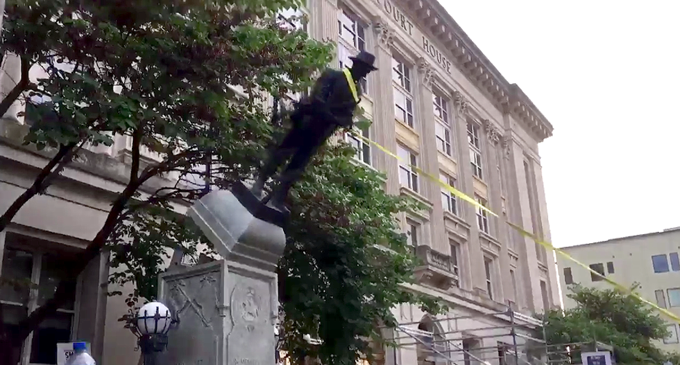 WATCH: Protestors topple statue honoring confederate soldiers in Durham NC
