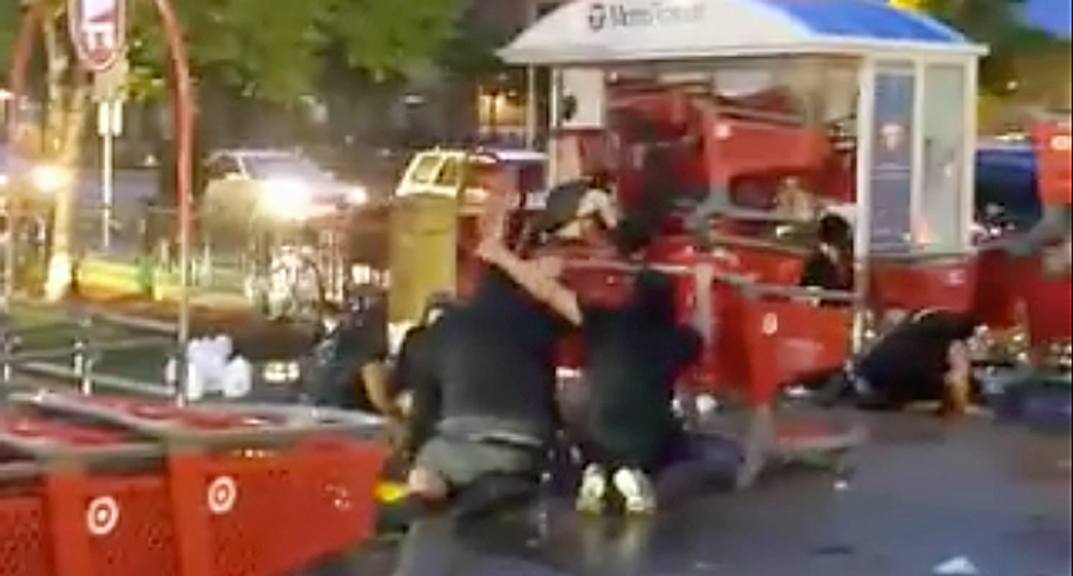 Protesters build ramparts from shopping carts at ‘The Battle of Snelling and Lake’ in Minneapolis