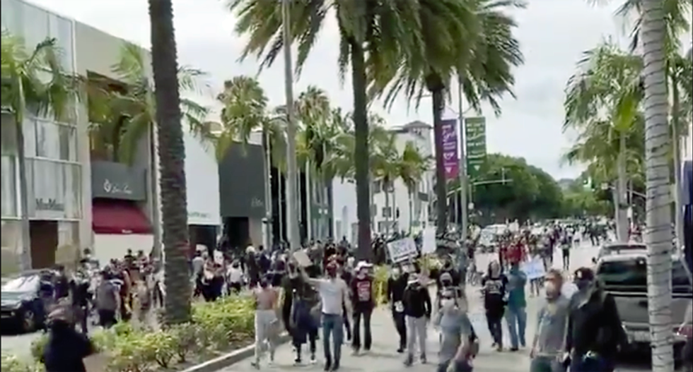 WATCH: Protesters chant 'Eat the Rich' while marching down Rodeo Drive in Beverly Hills