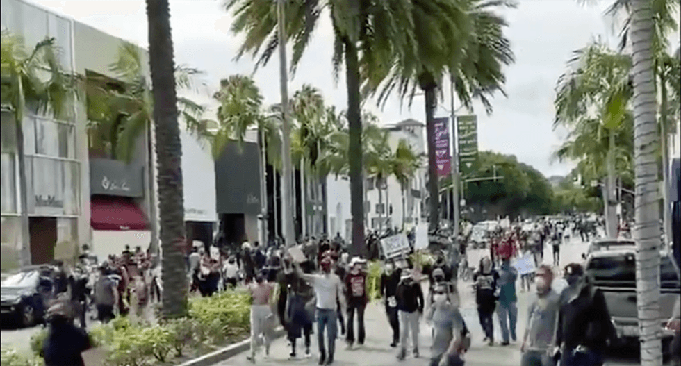 WATCH: Protesters chant 'Eat the Rich' while marching down Rodeo Drive in Beverly Hills