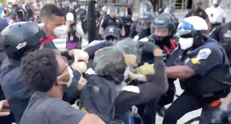 WATCH: DC protesters turn over 'agitator' to police -- then the agitators try to start a fight with cops
