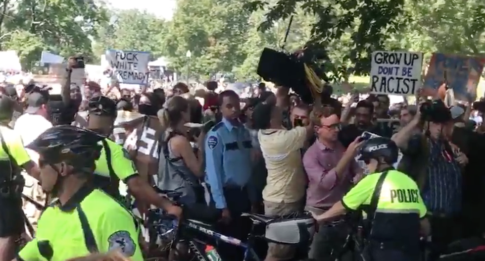 WATCH: Massive turnout of Boston counter-protesters chant 'shame' as police escort right-wingers