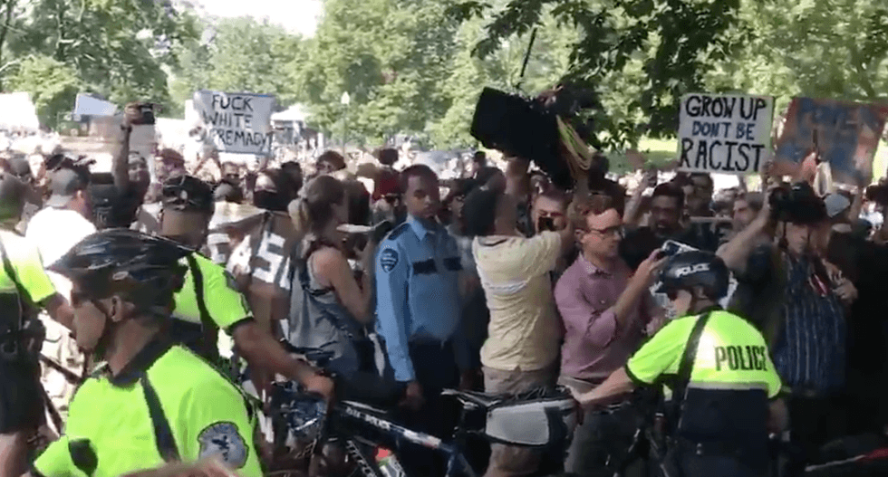 WATCH: Massive turnout of Boston counter-protesters chant 'shame' as police escort right-wingers