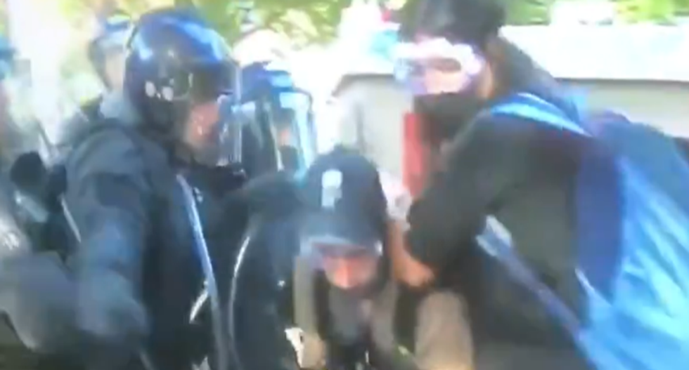 WATCH: Police bash cameraman as they push back peaceful crowds at White House