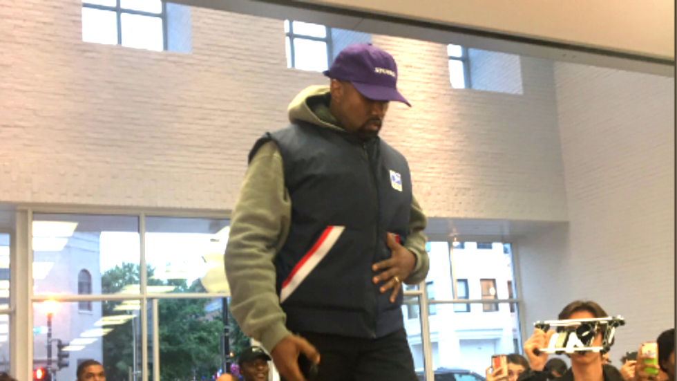 Kanye West goes to Apple Store and climbs on table to give speech after Trump meeting