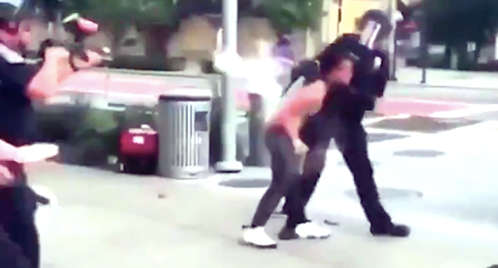 'Hit her! Hit her!' Indianapolis cops batter black protester with batons and pepper bullets