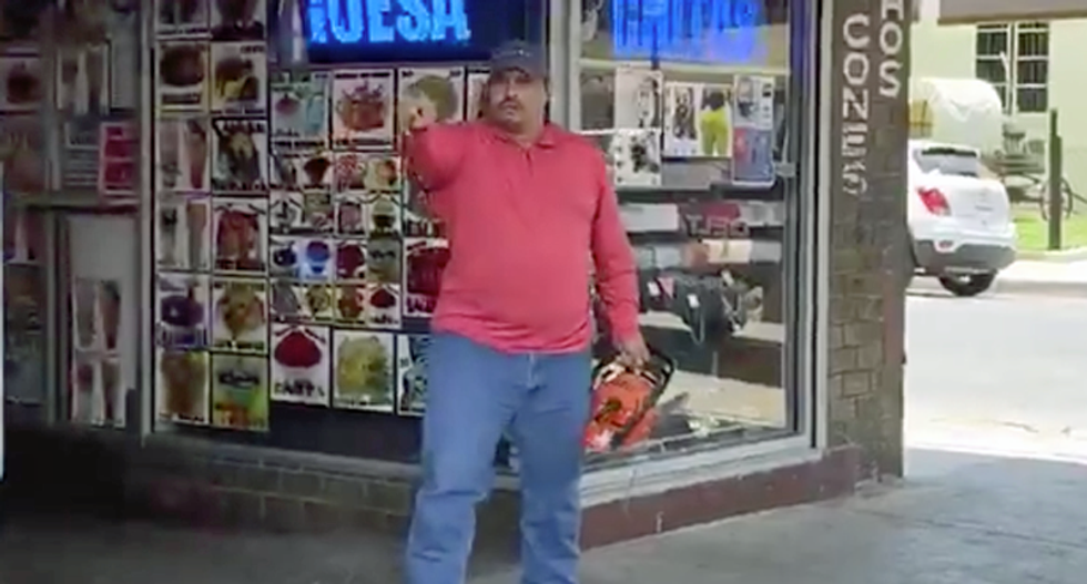 Texas man threatens protesters with chainsaw — while shouting the n-word