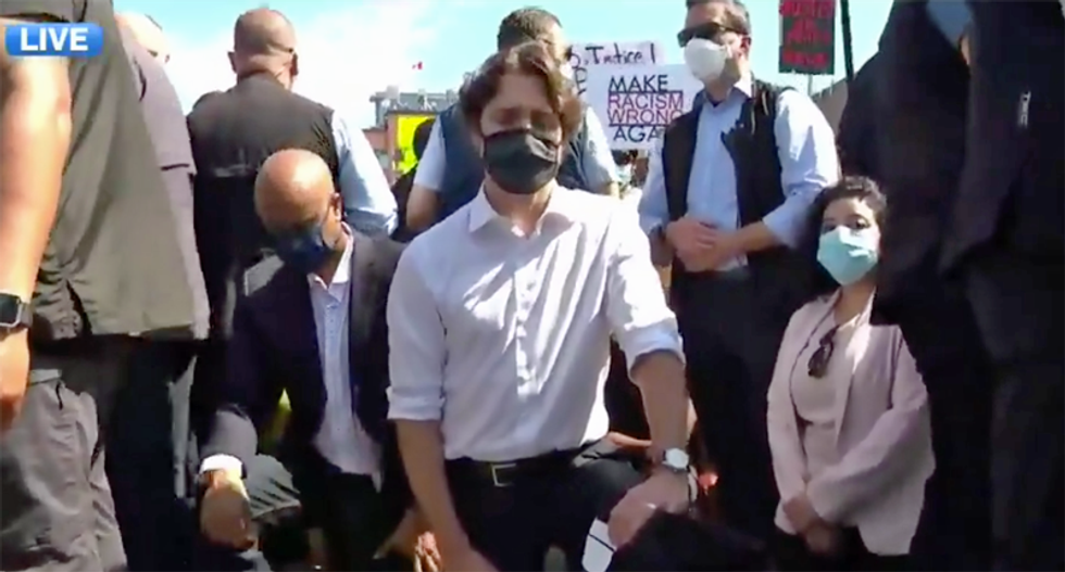 Justin Trudeau dons mask to attend anti-racism protests -- and takes a knee in solidarity