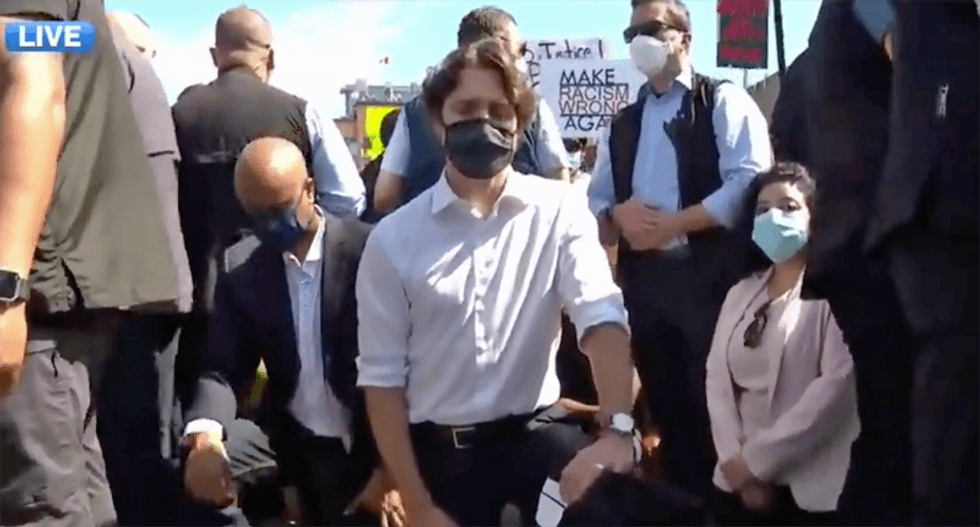 Justin Trudeau dons mask to attend anti-racism protests -- and takes a knee in solidarity