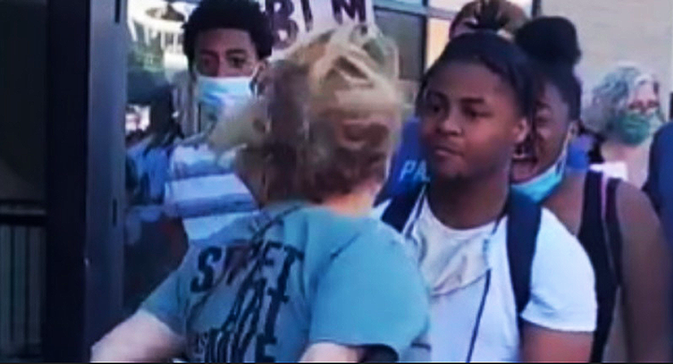 WATCH: Wisconsin attorney blocks protesters with her car -- and then spits on them
