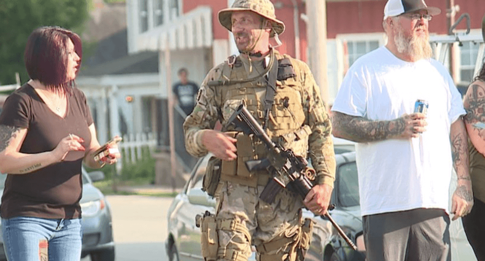Ohio village of 2,800 issues curfew after armed whites patrol streets waiting for busloads of Black Lives Matter protesters