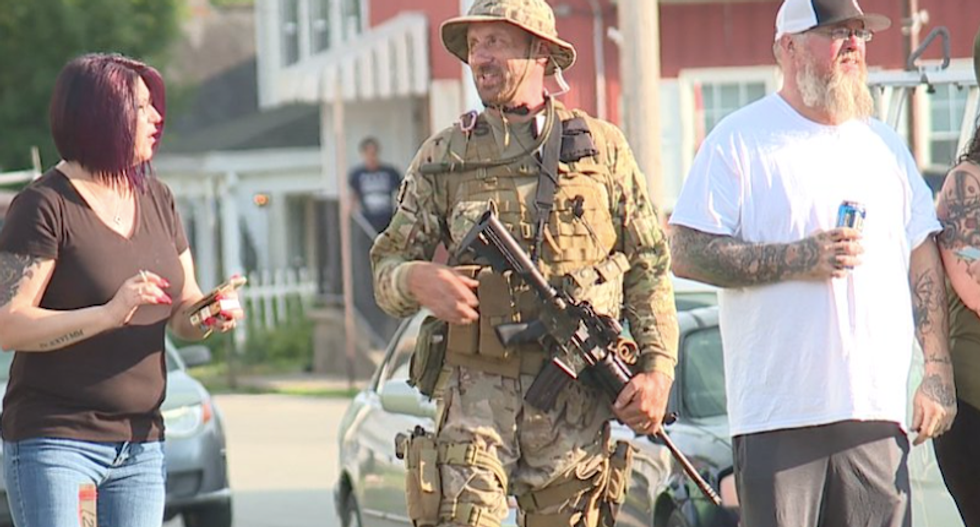 Ohio village of 2,800 issues curfew after armed whites patrol streets waiting for busloads of Black Lives Matter protesters