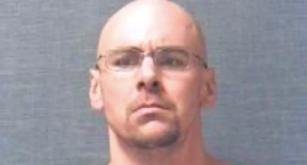 Ohio man busted on federal weapons charge after carrying anti-Semitic sign at lockdown protest