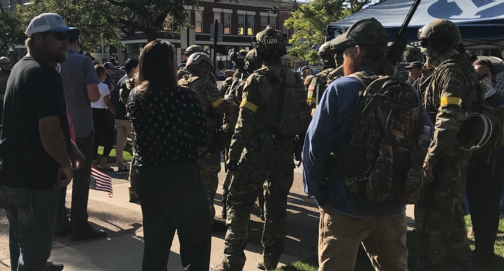 'They will not break our ranks': Armed camo-clad group moves in on Black Lives Matter protesters in Utah