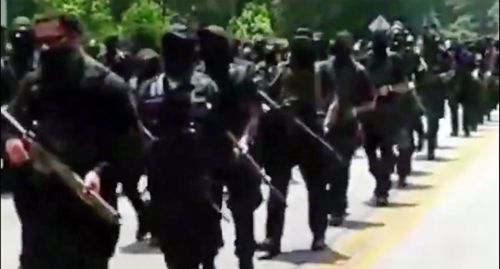 WATCH: Huge group of armed Black protesters march on Confederate monument in Georgia