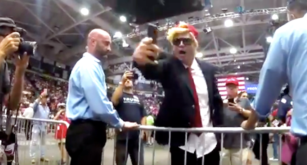Trump superfan screams anti-Semitic conspiracies about George Soros at CNN reporter in Florida rally