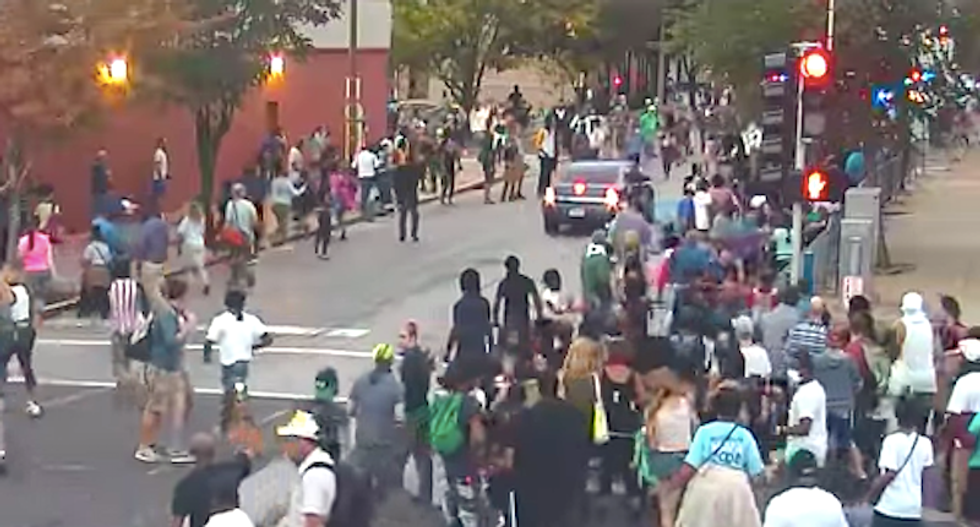 WATCH: Protesters scatter as St. Louis cops drive unmarked car in reverse through crowd