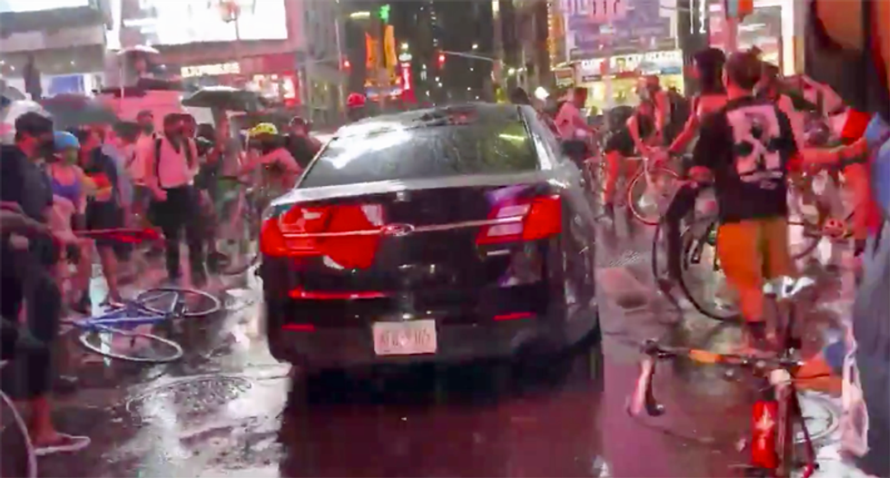 Shocking video shows car driving through crowd of protesters in Times Square -- victim says it was NYPD