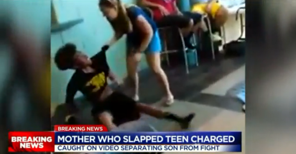 WATCH: Screaming white mom grabs black teen and slaps him across the face after school brawl