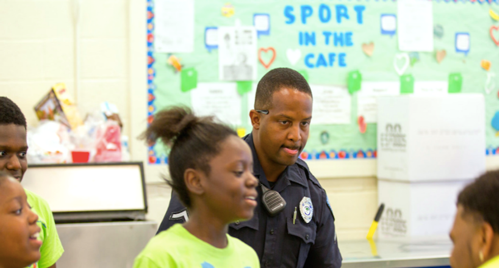 Why are police officers inside public schools?