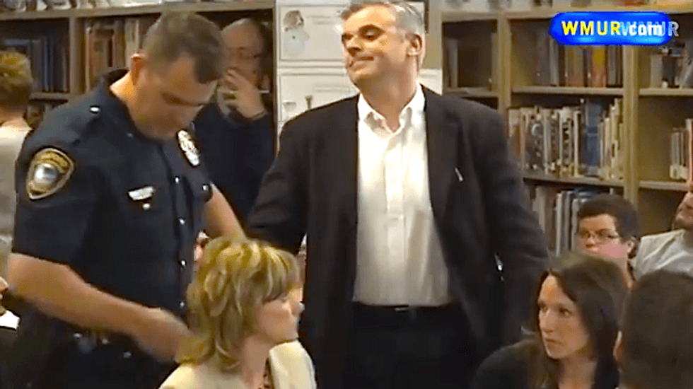 NH dad dares cops to arrest him during school board protest of controversial book assignment