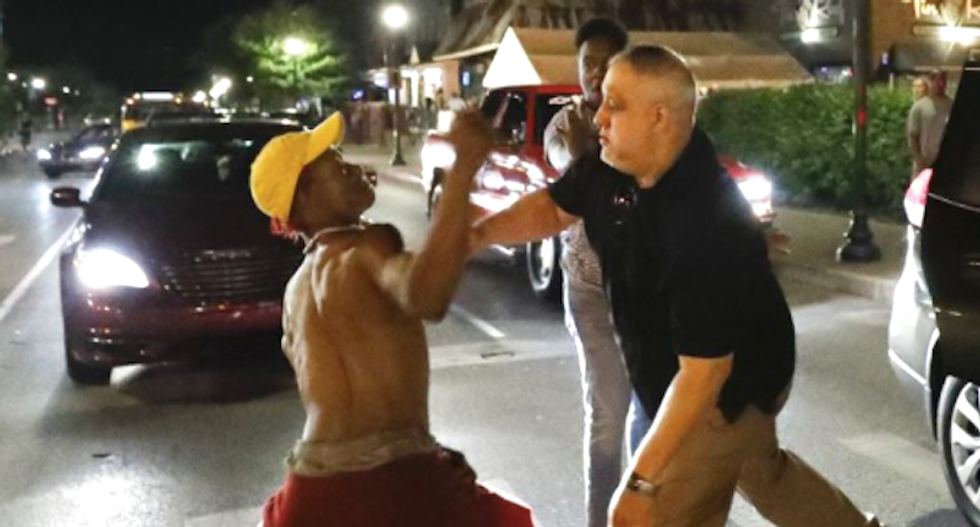WATCH: White man jumps out of Uber to confront Kentucky protesters -- gets punched and then punished by employer