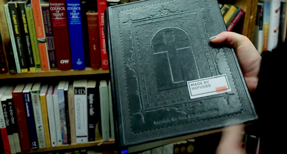 'Made by refugee': NYC artist puts labels on Bible and other products to change minds on refugee ban