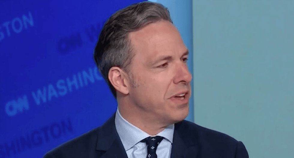 Watch CNN's Jake Tapper crack up after rolling a supercut of Pence praising Trump's 'broad shoulders'