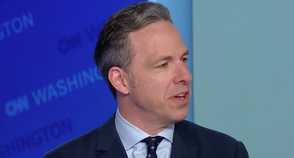 Watch CNN's Jake Tapper crack up after rolling a supercut of Pence praising Trump's 'broad shoulders'
