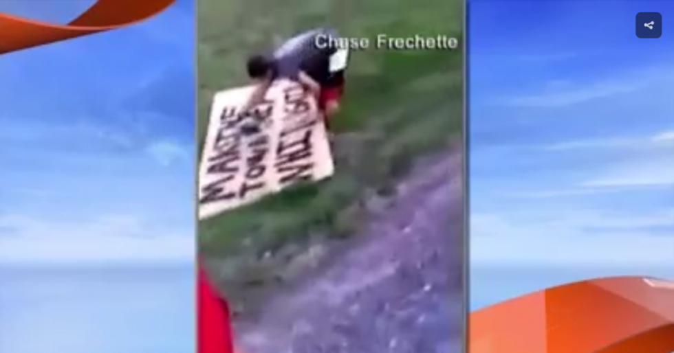 WATCH: Angry neighbor destroys Trump fan’s ‘Make the township white again’ sign with a chainsaw