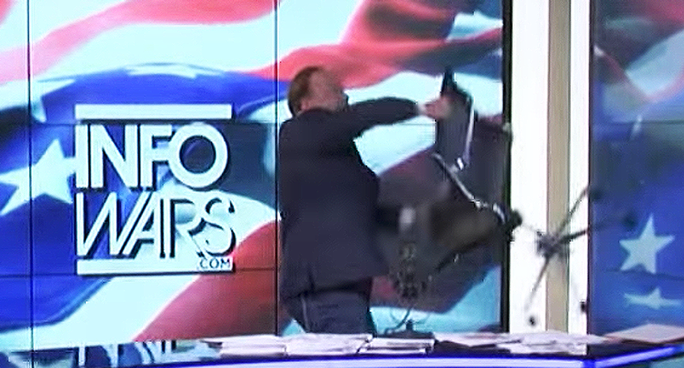 Alex Jones has the ultimate ragegasm over kids' story time with drag queens — and throws a chair