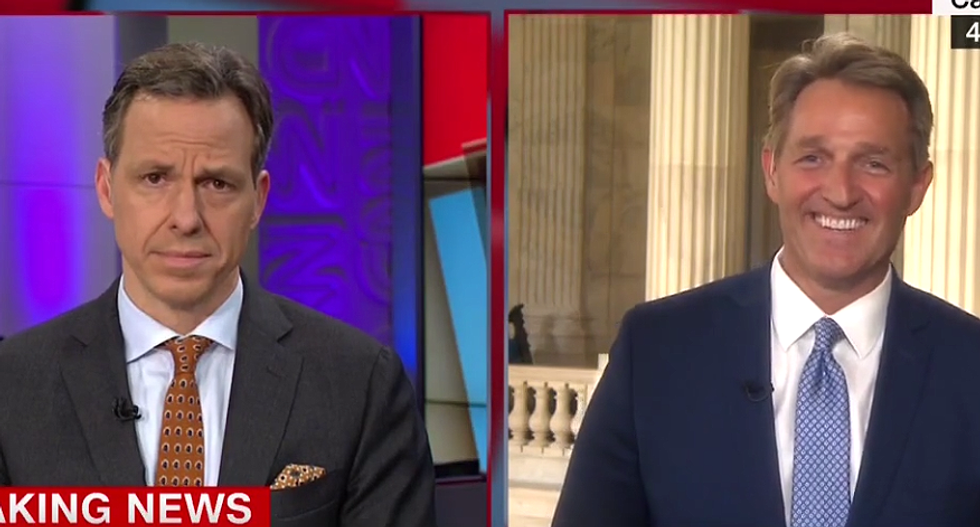 Watch Jeff Flake erupt in laughter after Jake Tapper asks if Trump 'broke' him: 'I'm still standing'
