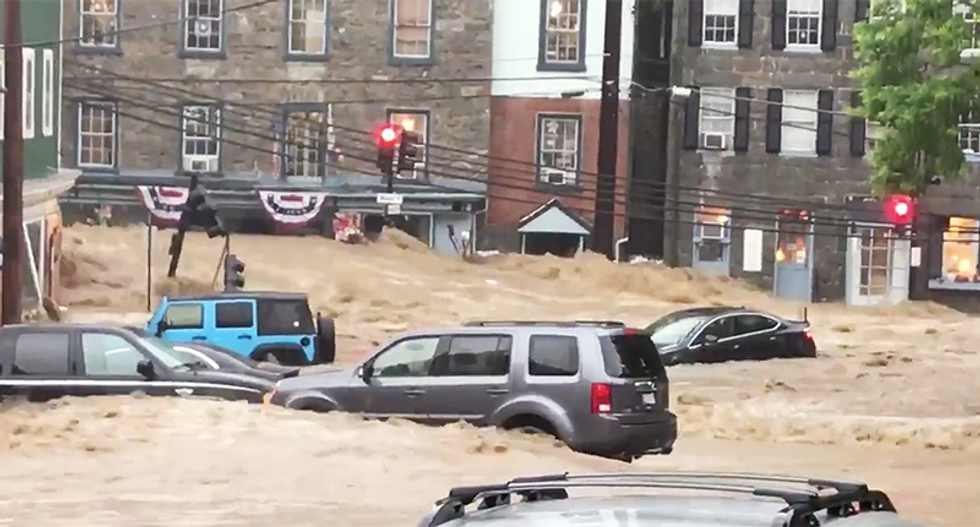 17 horrifying photos and videos of 'wall of water' in Ellicott City, Maryland as flood waters carry away cars
