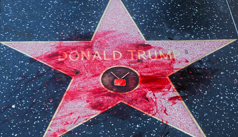 PETA employee claims he was fired for pouring fake blood on Trump's Hollywood star