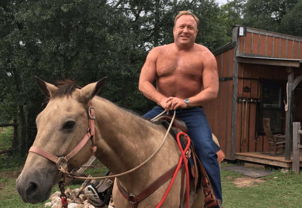 Alex Jones posts a topless picture of himself riding a horse -- and the internet can't stop laughing